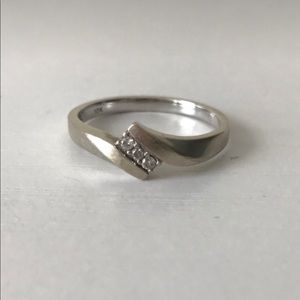 Size 6 white gold and diamond ring.
